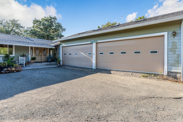 garage with covered porch