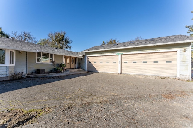 ranch-style home with a garage