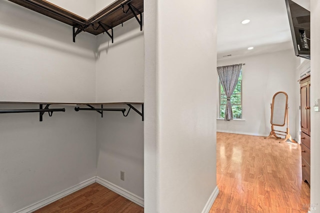 spacious closet featuring light wood-type flooring