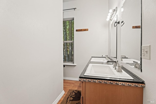 bathroom featuring hardwood / wood-style flooring and vanity