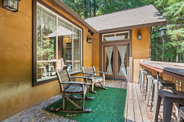 wooden deck featuring outdoor dry bar