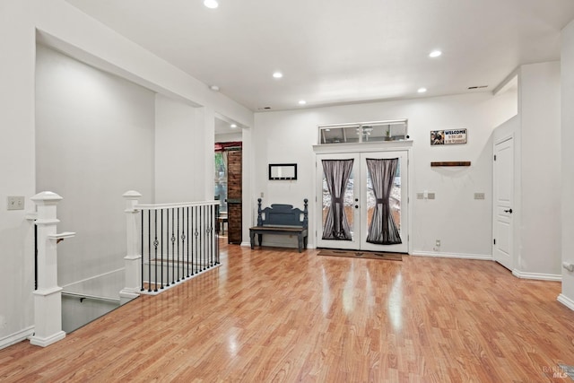 interior space featuring recessed lighting, french doors, and wood finished floors