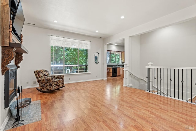 sitting room with hardwood / wood-style flooring