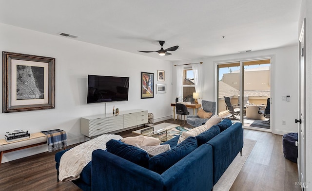 living room featuring light wood-type flooring and ceiling fan