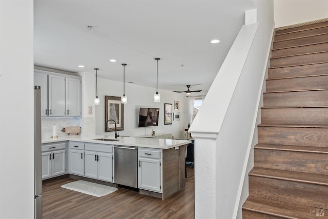 kitchen featuring tasteful backsplash, kitchen peninsula, sink, ceiling fan, and stainless steel dishwasher