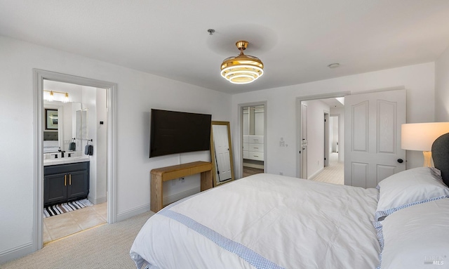 850 Mcclelland Dr, Windsor, CA 95492 - bedroom with light colored carpet, baseboards, a sink, light tile patterned floors, and ensuite bath