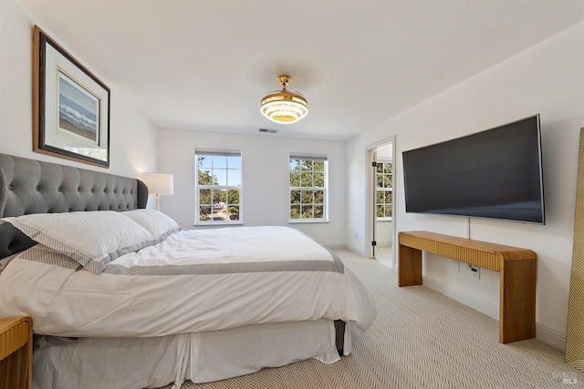 bedroom with light carpet