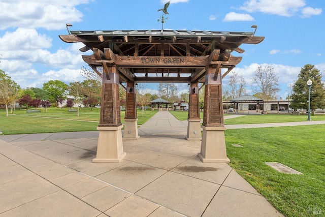 surrounding community featuring a lawn and a gazebo