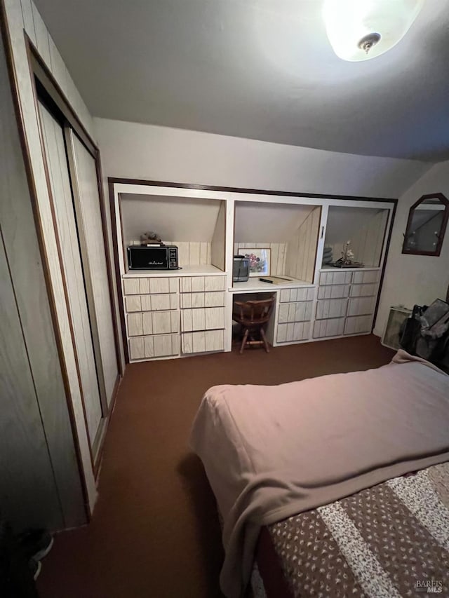 carpeted bedroom with a closet