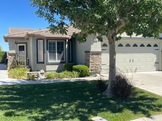 view of front of house with a garage and a front yard