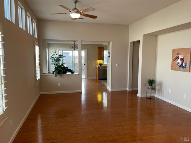 unfurnished room featuring dark hardwood / wood-style flooring and ceiling fan