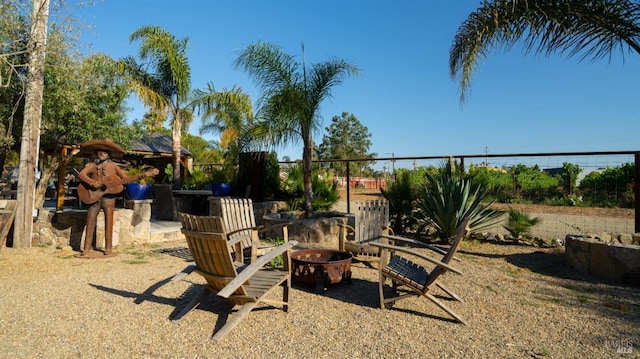 view of yard with an outdoor fire pit