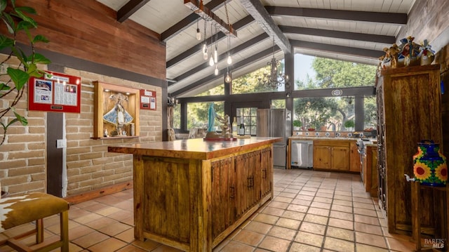 bar with stainless steel dishwasher, wooden ceiling, beamed ceiling, and brick wall