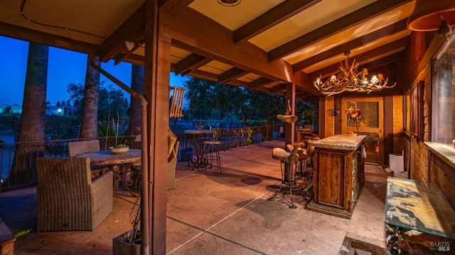 view of patio terrace at dusk