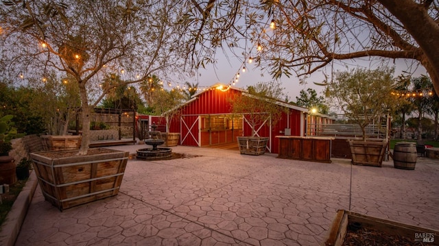 view of patio terrace at dusk