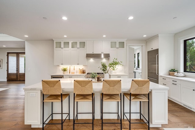 kitchen featuring a center island and white cabinets