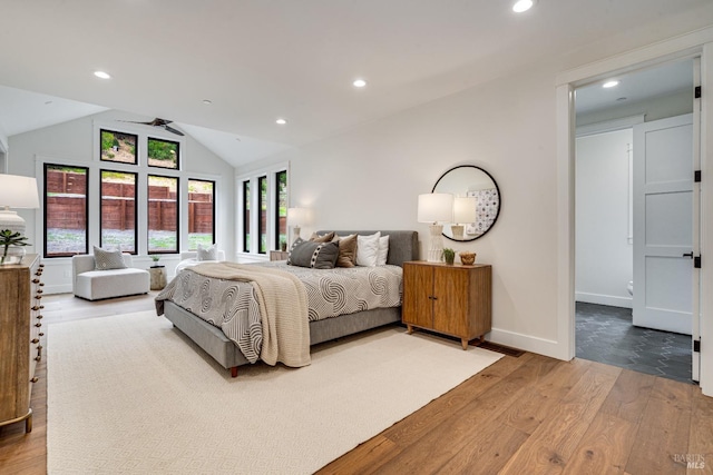 bedroom featuring lofted ceiling and hardwood / wood-style flooring