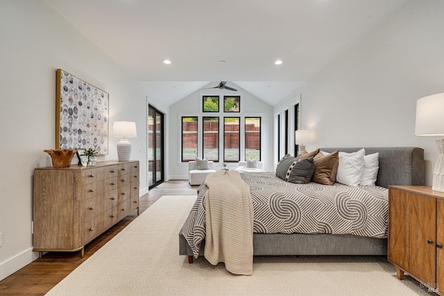 bedroom featuring lofted ceiling and hardwood / wood-style flooring