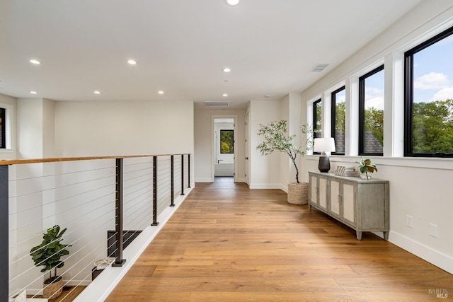 hall with light hardwood / wood-style floors