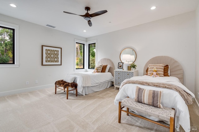 carpeted bedroom with ceiling fan