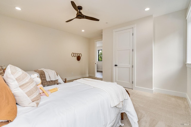 carpeted bedroom featuring ceiling fan