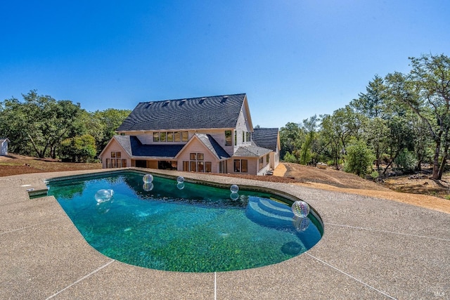 view of swimming pool with a patio area