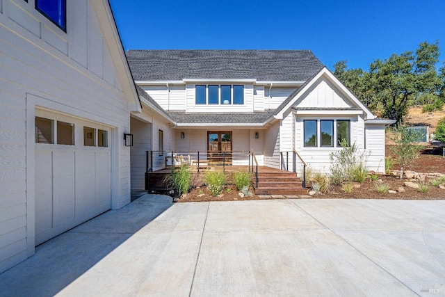 view of front of house featuring a garage and a porch