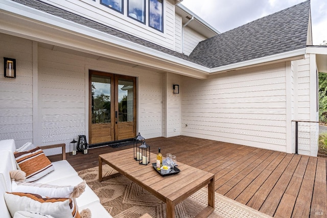 wooden terrace featuring french doors and an outdoor living space