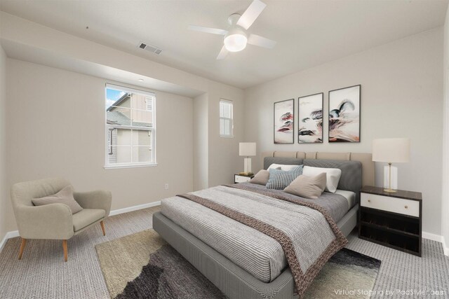 bedroom featuring ceiling fan and light carpet