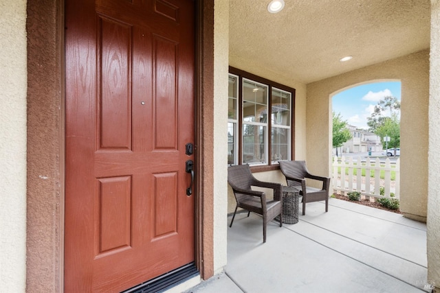 property entrance featuring a porch