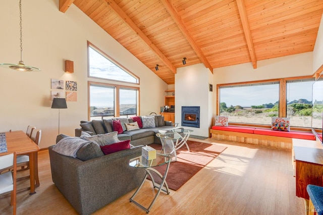 living room featuring wood ceiling, beamed ceiling, light hardwood / wood-style flooring, and high vaulted ceiling