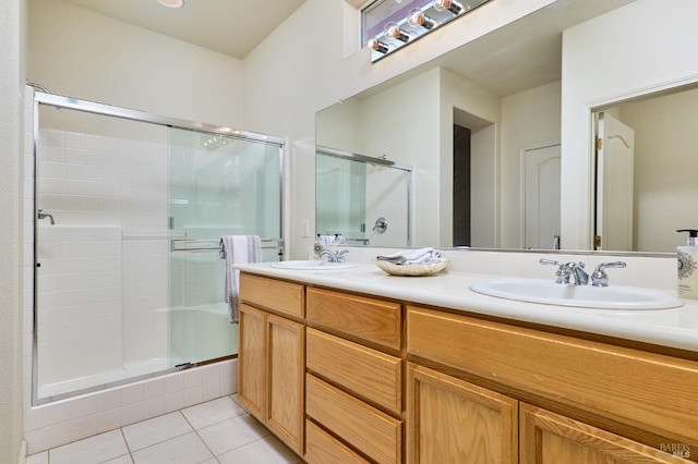 bathroom featuring vanity, an enclosed shower, and tile patterned flooring