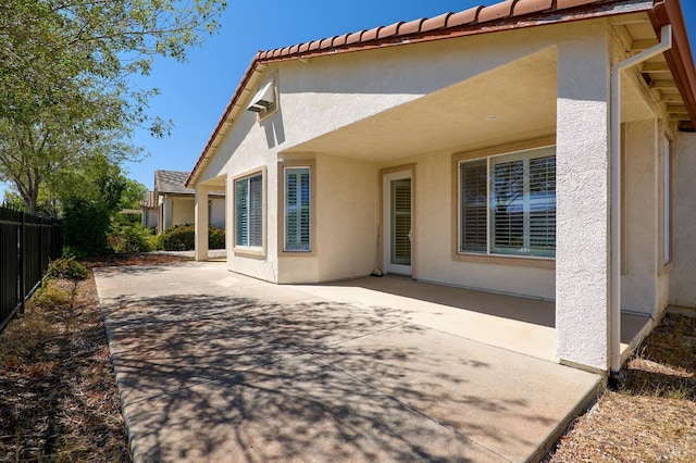 back of property featuring a patio area