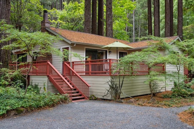 view of front of property featuring a wooden deck