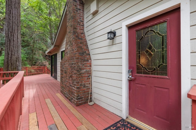 entrance to property featuring a deck