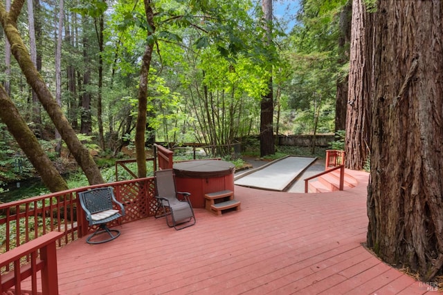 deck with a hot tub