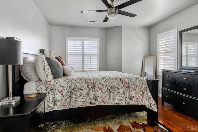 bedroom featuring ceiling fan and dark hardwood / wood-style floors