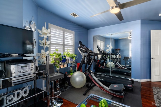 gym with hardwood / wood-style flooring and ceiling fan