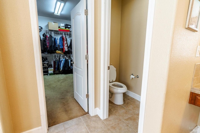 bathroom with tile patterned floors and toilet