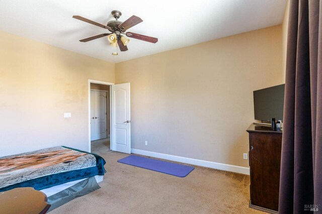 bedroom featuring ceiling fan and light colored carpet