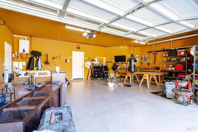 garage featuring a workshop area and a garage door opener