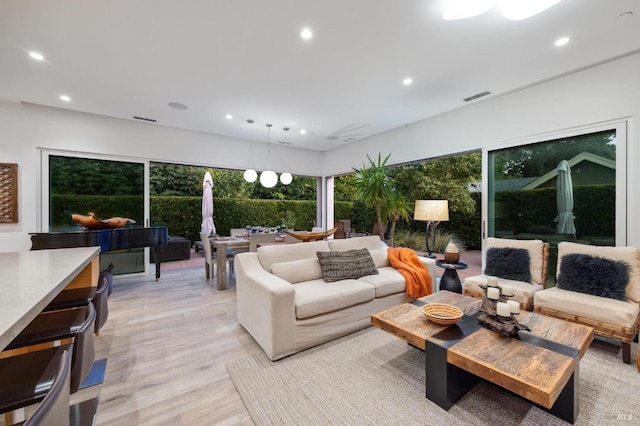 living room with light hardwood / wood-style floors