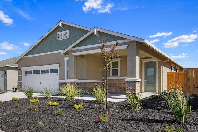 craftsman-style house with a garage and covered porch