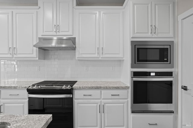 kitchen featuring light stone counters, backsplash, white cabinetry, ventilation hood, and stainless steel appliances