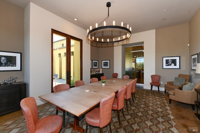 dining area featuring a chandelier, recessed lighting, and baseboards