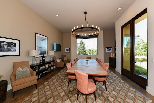 dining space with recessed lighting, baseboards, and an inviting chandelier