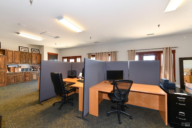 home office with dark colored carpet