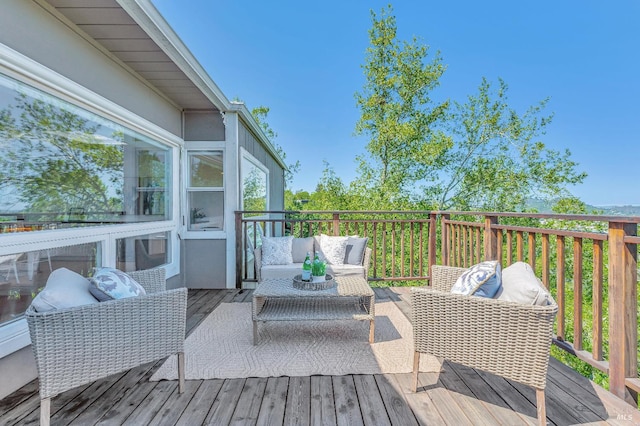 wooden deck featuring outdoor lounge area