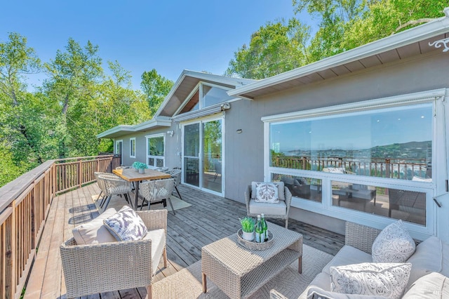 wooden deck with an outdoor living space