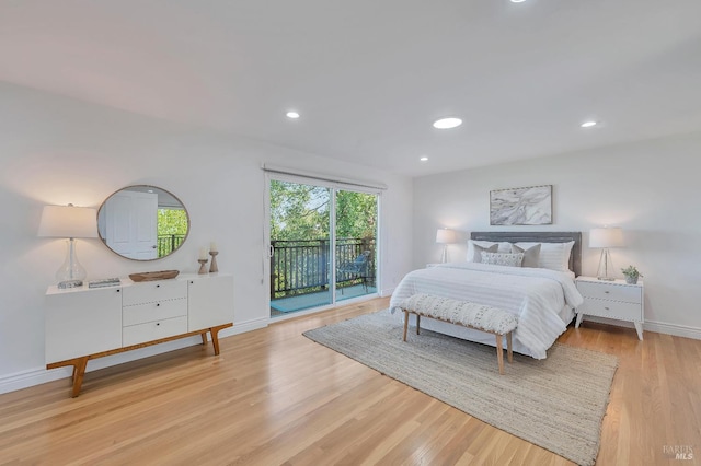 bedroom featuring light hardwood / wood-style flooring and access to exterior